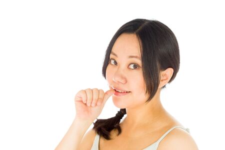 Pregnant adult asian woman isolated on white backgroundの写真素材