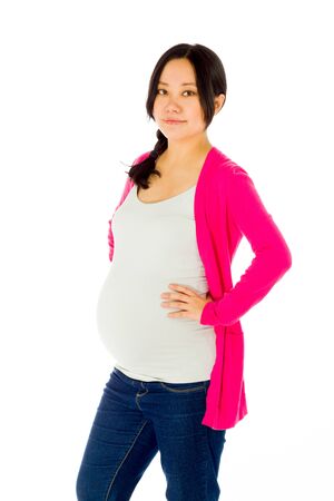 Pregnant adult asian woman isolated on white backgroundの写真素材