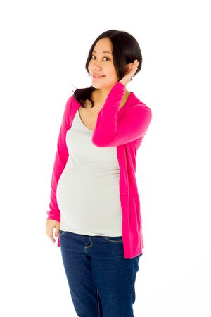 Pregnant adult asian woman isolated on white backgroundの写真素材
