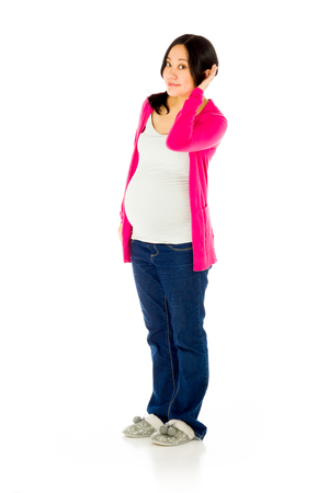 Pregnant adult asian woman isolated on white backgroundの写真素材