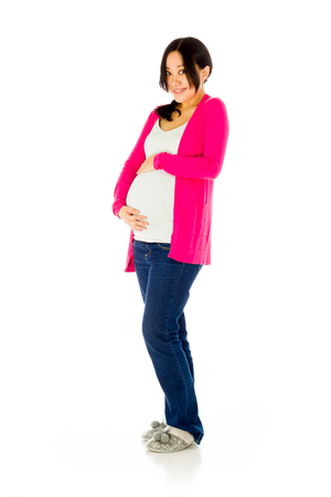 Pregnant adult asian woman isolated on white backgroundの写真素材