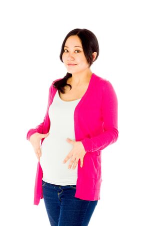 Pregnant adult asian woman isolated on white backgroundの写真素材