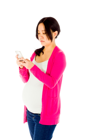 Pregnant adult asian woman isolated on white backgroundの写真素材