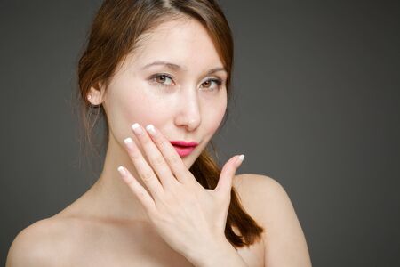 Model isolated covering mouthの写真素材