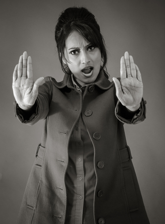 Adult indian woman in studio isolated on grey background, black and white imageの写真素材