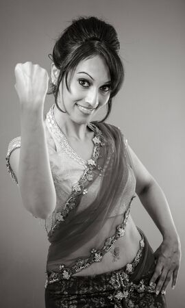 Adult indian woman in studio isolated on grey background, black and white imageの写真素材