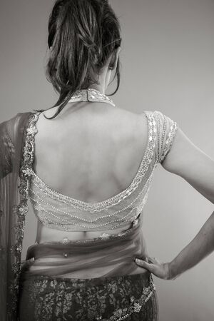 Adult indian woman in studio isolated on grey background, black and white imageの写真素材