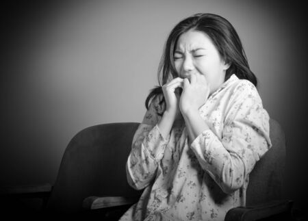 Attractive Asian girl in her 20s at the theatre isolate on a white background, black and white imageの写真素材