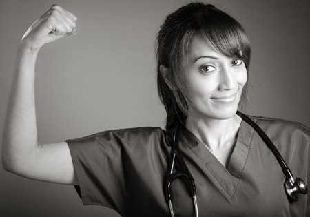 Attractive Indian doctor woman posing in a studio in front of a background, black and white imageの写真素材