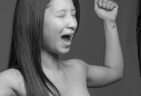 Model happy successful arms in the airの写真素材