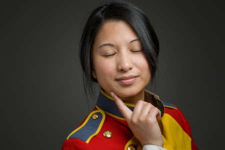 Model isolated on plain background in studio thinking searchingの写真素材