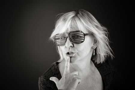 model isolated with finger on lips secret