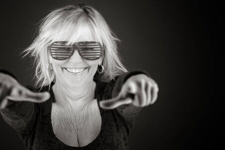 model isolated on plain background fingers pointing to cameraの写真素材