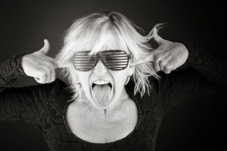 model isolated on plain background plugging ears with fingersの写真素材