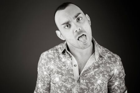 model isolated on plain background face sticking tongue outの写真素材