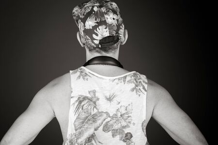 model isolated on plain background back hands on hipsの写真素材