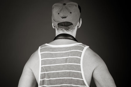 model isolated on plain background back hands on hipsの写真素材