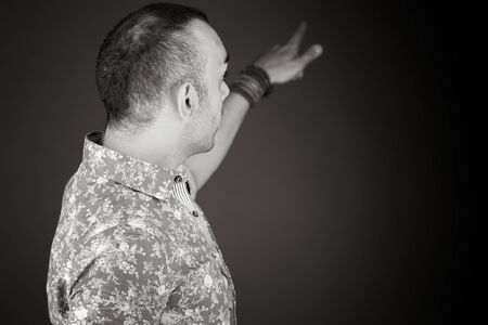 model isolated on plain background back pointingの写真素材