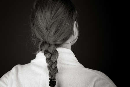 model isolated on plain background back hands on hipsの写真素材