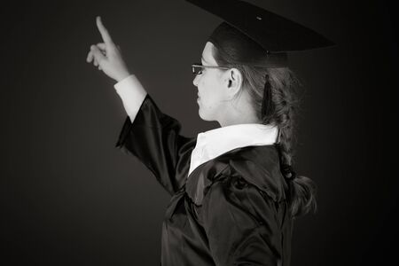 Model in studio isolated on plain grey backgroundの写真素材