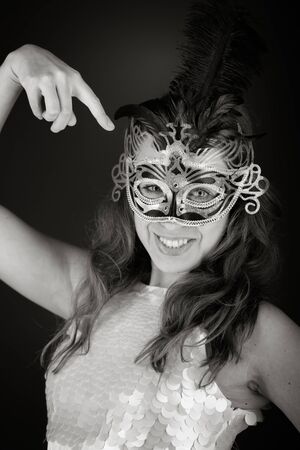 Model in studio isolated on plain grey backgroundの写真素材