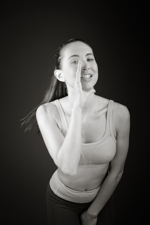 model isolated on plain background calling shoutingの写真素材