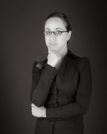 Model in studio isolated on plain grey backgroundの写真素材