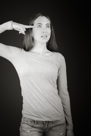 Model in studio isolated on plain grey backgroundの写真素材