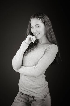 Model in studio isolated on plain grey backgroundの写真素材