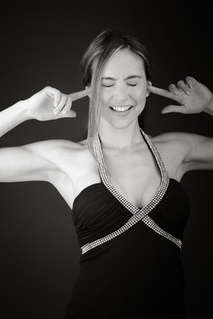 Model in studio isolated on plain grey backgroundの写真素材