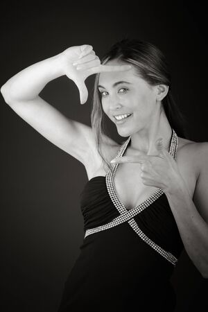 Model in studio isolated on plain grey backgroundの写真素材
