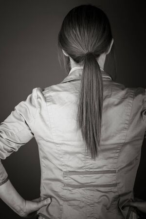 model isolated on plain background back hands on hipsの写真素材