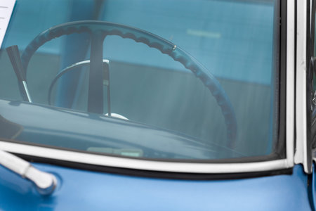 Steering wheel of a blue shiny classic vintage carの写真素材