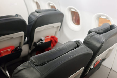 Interiors of empty airline window seat