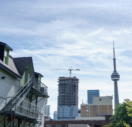 Buildings in city against cloudy sky, Toronto, Ontario, Canadaのeditorial素材