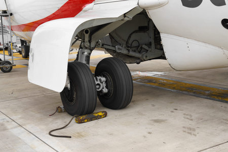 Wheel chocks deployed on an airplanes landing gear