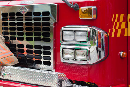 Close-up of headlights of red fire truck