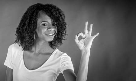 attractive woman on plein background shot in studio with soft lights with an interesting expression and dramatic lighting Black And White, b&wの写真素材