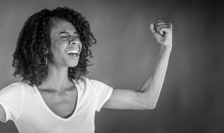 attractive woman on plein background shot in studio with soft lights with an interesting expression and dramatic lighting Black And White, b&wの写真素材