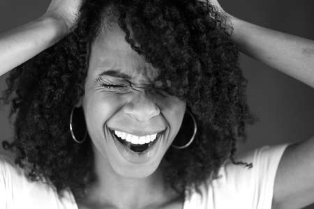 attractive woman on plein background shot in studio with soft lights with an interesting expression and dramatic lighting Black And White, b&wの写真素材