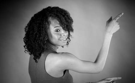 attractive woman on plein background shot in studio with soft lights with an interesting expression and dramatic lighting Black And White, b&wの写真素材