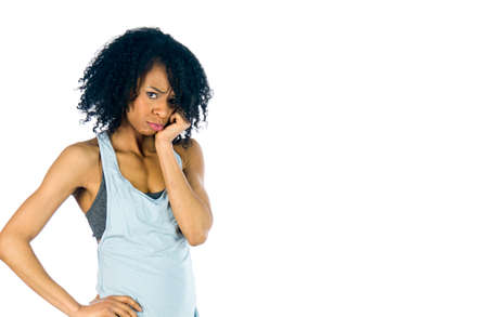 attractive woman on plein background shot in studio with soft lights with an interesting expression and dramatic lightingの写真素材