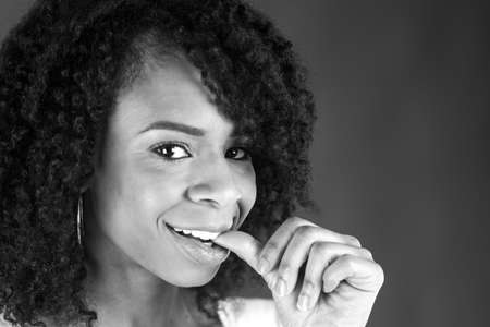 attractive woman on plein background shot in studio with soft lights with an interesting expression and dramatic lighting Black And White, b&wの写真素材