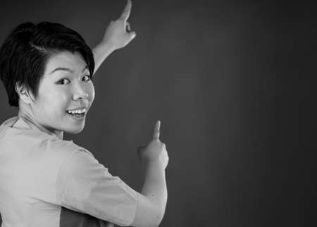 attractive woman on plein background shot in studio with soft lights with an interesting expression and dramatic lighting Black And White, b&wの写真素材