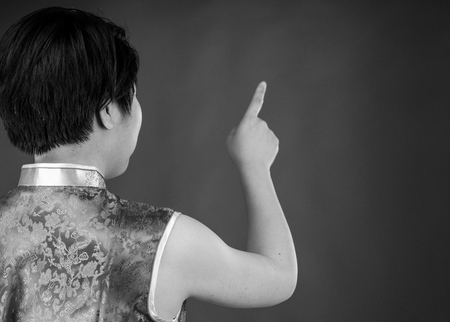 attractive woman on plein background shot in studio with soft lights with an interesting expression and dramatic lighting Black And White, b&wの写真素材