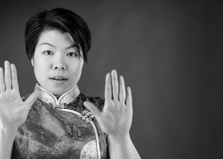 attractive woman on plein background shot in studio with soft lights with an interesting expression and dramatic lighting Black And White, b&wの写真素材