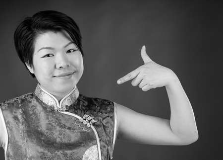 attractive woman on plein background shot in studio with soft lights with an interesting expression and dramatic lighting Black And White, b&wの写真素材
