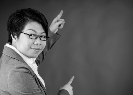 attractive woman on plein background shot in studio with soft lights with an interesting expression and dramatic lighting Black And White, b&wの写真素材