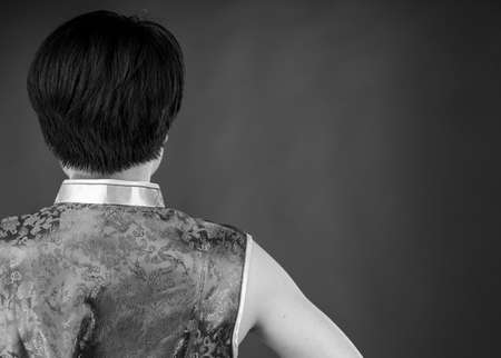 attractive woman on plein background shot in studio with soft lights with an interesting expression and dramatic lighting Black And White, b&wの写真素材