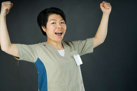 attractive woman on plein background shot in studio with soft lights with an interesting expression and dramatic lightingの写真素材